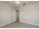 This bedroom features neutral walls, ceiling fan, an entrance to another room and closet at 8721 Bay Crest Ln, Tampa, FL 33615