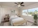 Bright bedroom with plenty of natural light, a ceiling fan, and a waterfront view at 8721 Bay Crest Ln, Tampa, FL 33615