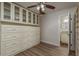 A walk in closet with built-in drawers and shelves and an entry into the bathroom at 8721 Bay Crest Ln, Tampa, FL 33615