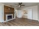 Living room with a fireplace and an entry into the kitchen at 8721 Bay Crest Ln, Tampa, FL 33615