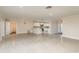 Large open concept living space adjacent to the kitchen with modern lighting at 8721 Bay Crest Ln, Tampa, FL 33615