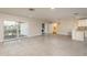 Open floor plan of the home, leading to a living area, kitchen, and access to the canal at 8721 Bay Crest Ln, Tampa, FL 33615