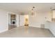 Open-concept living space with views of the kitchen and fireplace at 8721 Bay Crest Ln, Tampa, FL 33615