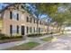 Charming townhouses featuring well-manicured lawns and black shutters, great for curb appeal at 9534 W Park Village Dr, Tampa, FL 33626