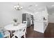 Beautiful, bright kitchen with white cabinets, stainless steel appliances, and a cozy dining area at 9534 W Park Village Dr, Tampa, FL 33626