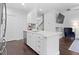 Charming kitchen island with stainless steel sink, modern appliances, and ample cabinet space at 9534 W Park Village Dr, Tampa, FL 33626