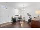 Bright office space with wood floors, modern chandelier and peloton at 9534 W Park Village Dr, Tampa, FL 33626