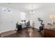 Bright office space with wood floors, modern chandelier and peloton at 9534 W Park Village Dr, Tampa, FL 33626