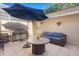 Outdoor patio with comfortable seating, a dining area, and a grill, creating a perfect space for relaxation at 9534 W Park Village Dr, Tampa, FL 33626