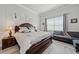 Primary bedroom featuring natural lighting and neutral wall paint and matching furniture at 10303 Malvasia Ave, Riverview, FL 33578