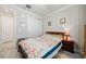 Bedroom with light-colored walls, a decorative headboard, and a large closet at 10303 Malvasia Ave, Riverview, FL 33578