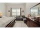 Cozy bedroom with ample natural light, and a dresser at 10303 Malvasia Ave, Riverview, FL 33578