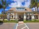 An inviting community clubhouse exterior featuring parking and manicured landscaping, a welcoming entrance at 10303 Malvasia Ave, Riverview, FL 33578