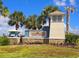 Elegant community entrance sign with stone accents, lush landscaping, and a welcoming atmosphere at 10303 Malvasia Ave, Riverview, FL 33578
