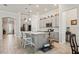 Kitchen featuring a central island, white cabinets, and stainless steel appliances at 10303 Malvasia Ave, Riverview, FL 33578