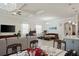 Open floor plan showcasing the living room, dining area, and adjacent kitchen with island at 10303 Malvasia Ave, Riverview, FL 33578
