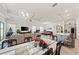 Open-concept living area with modern lighting, a living room and a bright kitchen at 10303 Malvasia Ave, Riverview, FL 33578