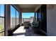 The outdoor patio with comfortable seating, neutral tiling, and scenic views of the bright blue sky at 10303 Malvasia Ave, Riverview, FL 33578