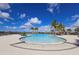 Inviting zero-entry pool with surrounding lounge area, perfect for relaxation and soaking up the sun at 10303 Malvasia Ave, Riverview, FL 33578