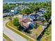 Aerial view of home with screened pool, shed and mature trees at 10833 96Th N St, Largo, FL 33773