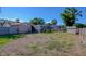 Large fenced backyard featuring a screened-in pool and storage shed at 10833 96Th N St, Largo, FL 33773