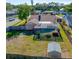 Aerial view of backyard with screened pool, shed, and fenced in yard at 10833 96Th N St, Largo, FL 33773