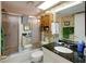 Bathroom with shower/tub combination, granite countertop and wallpaper at 10833 96Th N St, Largo, FL 33773