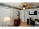This bedroom features wood floors, an updated ceiling fan, and ample storage at 10833 96Th N St, Largo, FL 33773