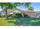 Charming single-story home with mature landscaping and green lawn at 10833 96Th N St, Largo, FL 33773