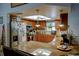 Well-equipped kitchen featuring wood cabinets, granite countertops, and a breakfast bar for casual dining at 10833 96Th N St, Largo, FL 33773