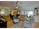 Open-concept living room featuring a ceiling fan, comfortable seating, and a seamless connection to the kitchen at 10833 96Th N St, Largo, FL 33773