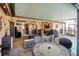 This covered patio features ample seating, an outdoor bar, and access to the pool at 10833 96Th N St, Largo, FL 33773