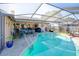 Enjoy a relaxing swim in this crystal-clear pool with a covered lanai at 10833 96Th N St, Largo, FL 33773