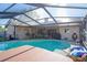 This refreshing screened-in pool offers a relaxing outdoor experience at 10833 96Th N St, Largo, FL 33773