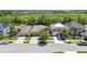An aerial view showcases houses with palm trees and large lawns at 11506 Mansfield Point Dr, Riverview, FL 33569