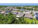 An aerial view of houses surrounded by lots of trees at 11506 Mansfield Point Dr, Riverview, FL 33569