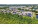 An aerial view of a residential community with a lake nearby at 11506 Mansfield Point Dr, Riverview, FL 33569