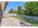 The backyard features a paver patio and green grass at 11506 Mansfield Point Dr, Riverview, FL 33569