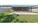 The backyard features a screened-in patio and paver patio at 11506 Mansfield Point Dr, Riverview, FL 33569