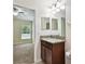 Bathroom features a granite countertop and view into bedroom at 11506 Mansfield Point Dr, Riverview, FL 33569