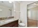 Bathroom features a granite countertop and view to bedroom at 11506 Mansfield Point Dr, Riverview, FL 33569