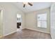 Bedroom featuring carpet, window, and ensuite bath at 11506 Mansfield Point Dr, Riverview, FL 33569