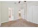 Bedroom featuring carpet and ensuite bath at 11506 Mansfield Point Dr, Riverview, FL 33569