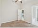 Bedroom with carpet and open door to hall at 11506 Mansfield Point Dr, Riverview, FL 33569