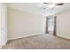 Relaxing bedroom with carpet flooring, ceiling fan, and a window with curtains for natural light at 11506 Mansfield Point Dr, Riverview, FL 33569