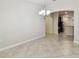 Dining area featuring tile flooring and an archway leading to the kitchen at 11506 Mansfield Point Dr, Riverview, FL 33569