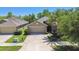 Charming single-Gathering home with a two-car garage and well-manicured landscaping at 11506 Mansfield Point Dr, Riverview, FL 33569