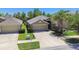 Charming single-Gathering home with a two-car garage and well-manicured landscaping at 11506 Mansfield Point Dr, Riverview, FL 33569