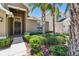Inviting front porch features a side light and lush landscaping at 11506 Mansfield Point Dr, Riverview, FL 33569