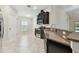 Modern kitchen featuring granite counters, stainless appliances, and ample cabinet space at 11506 Mansfield Point Dr, Riverview, FL 33569